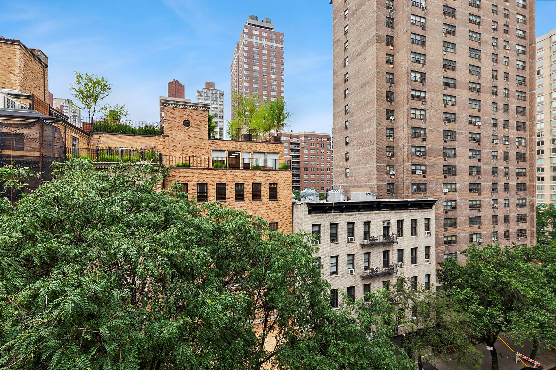 330 East 70th Street, Unit 6E Manhattan, NY 10021 - Photo 8 of 9 a view of a building with a garden