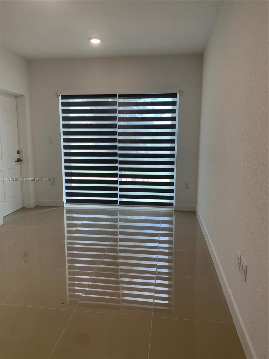 25680 Southwest 143rd Avenue Homestead, FL 33032 - Photo 12 of 20 a view of a room with a large window