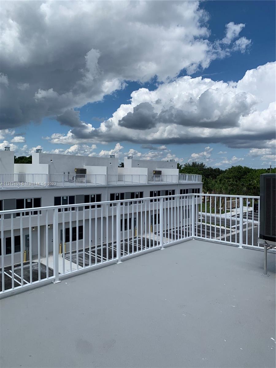 25680 Southwest 143rd Avenue Homestead, FL 33032 - Photo 13 of 20 a view of a balcony with city view