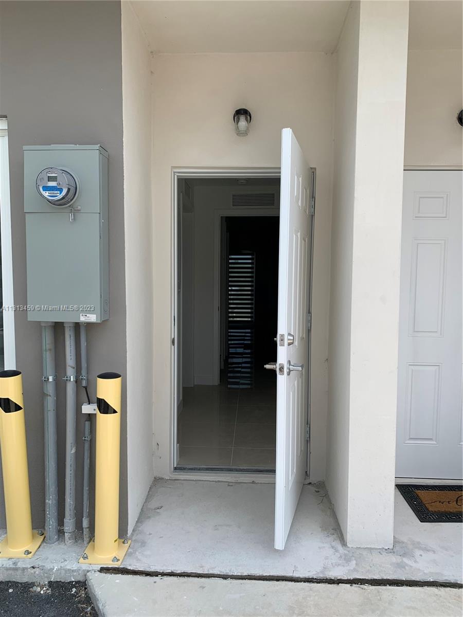 25680 Southwest 143rd Avenue Homestead, FL 33032 - Photo 15 of 20 a view of an entryway of house
