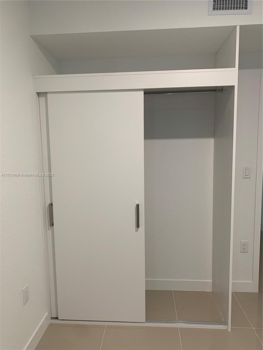 25680 Southwest 143rd Avenue Homestead, FL 33032 - Photo 18 of 20 a bathroom with a shower