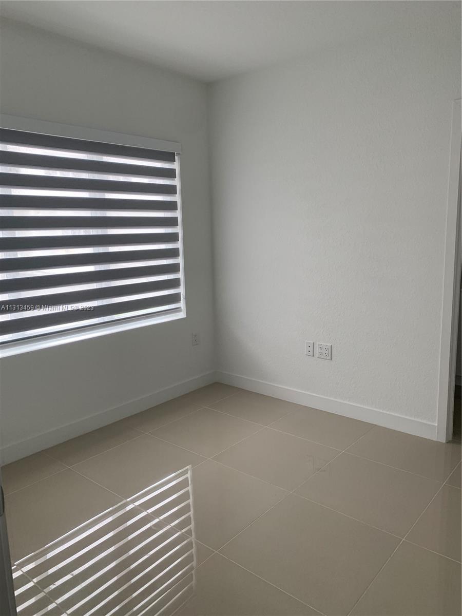 25680 Southwest 143rd Avenue Homestead, FL 33032 - Photo 19 of 20 a view of a room that has a window