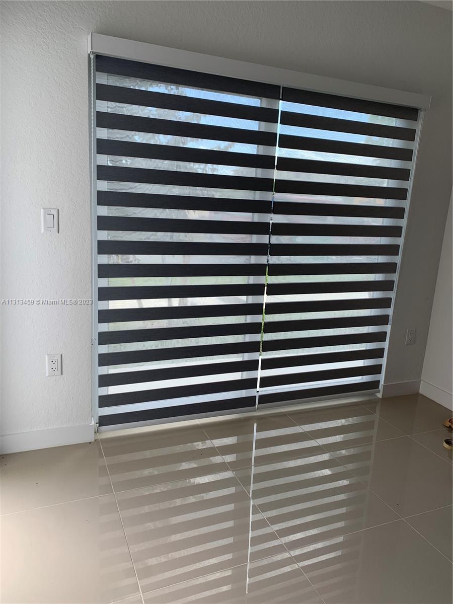 25680 Southwest 143rd Avenue Homestead, FL 33032 - Photo 4 of 20 a view of a room with a window