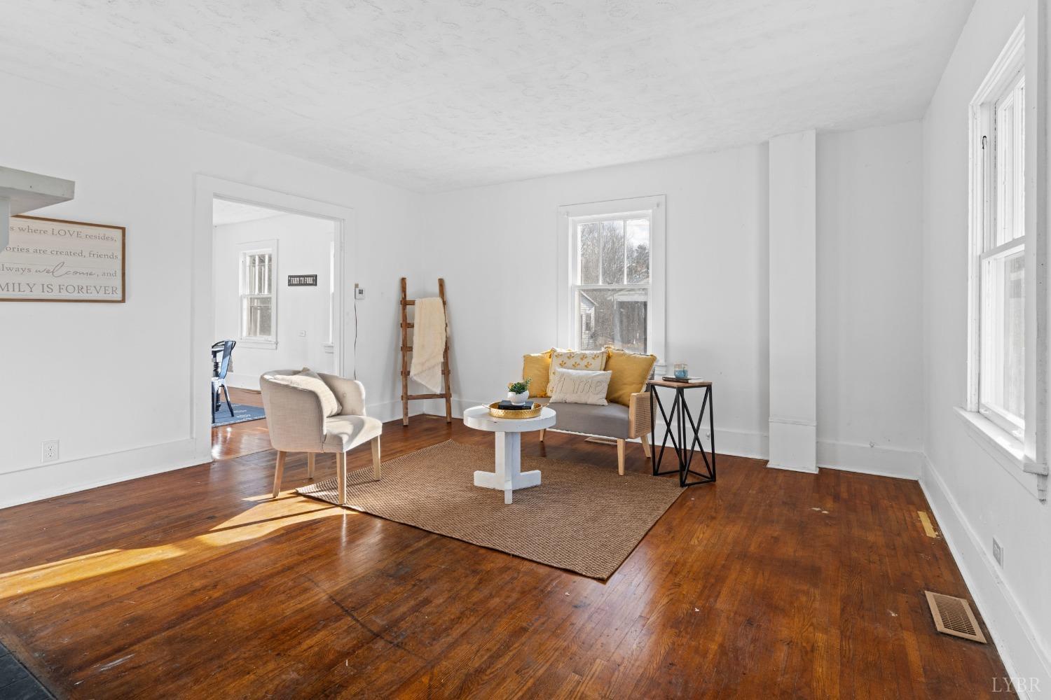 4769 Spring Garden Road Chatham, VA 24531 - Photo 3 of 44 a living room with furniture and a wooden floor