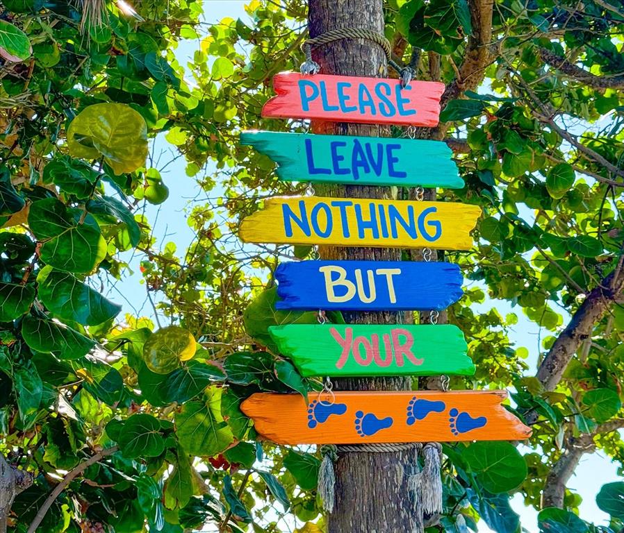 127 11th Avenue Indian Rocks Beach, FL 33785 - Photo 56 of 63 an sign that is on a tree