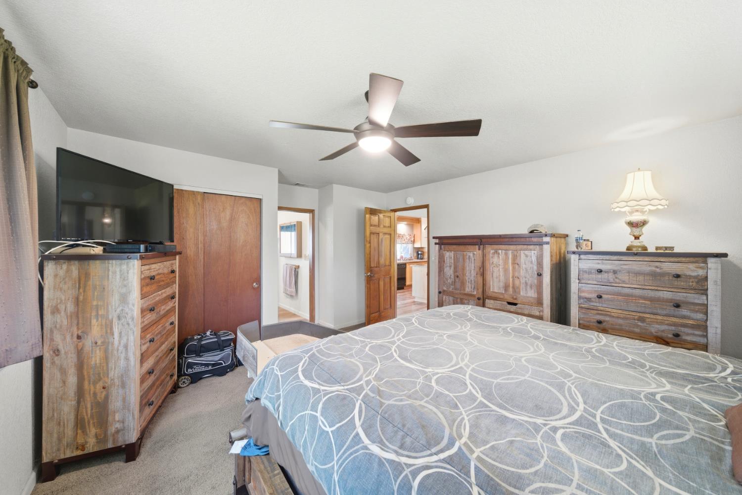 15828 Barney Road Plymouth, CA 95669 - Photo 18 of 71 a bedroom with a bed and a flat screen tv