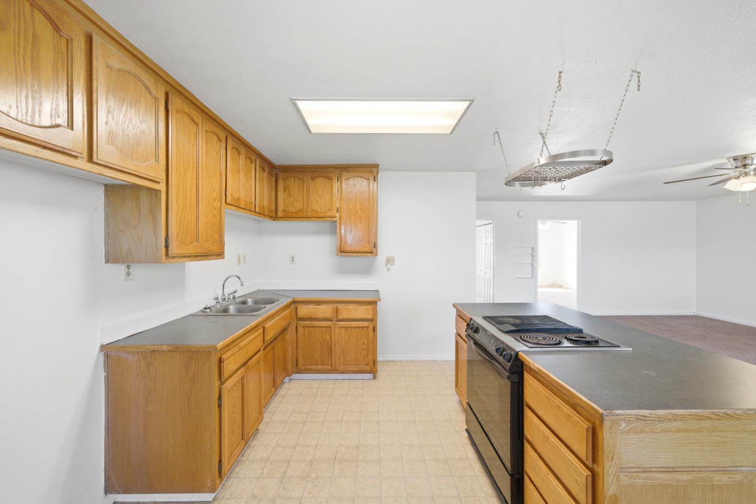 15828 Barney Road Plymouth, CA 95669 - Photo 31 of 71 a kitchen with stainless steel appliances granite countertop a sink stove and cabinets