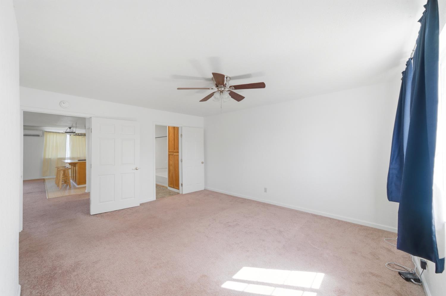 15828 Barney Road Plymouth, CA 95669 - Photo 39 of 71 a view of a room with a ceiling fan and window