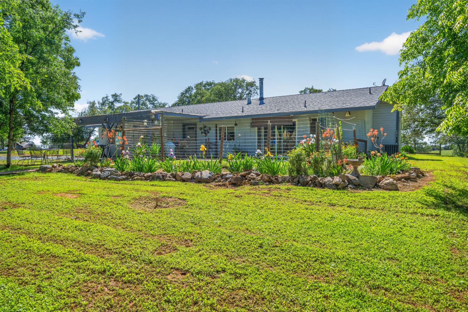 15828 Barney Road Plymouth, CA 95669 - Photo 47 of 71 a front view of a house with garden
