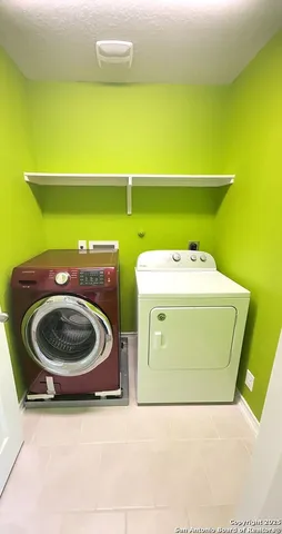 a utility room with a washer and dryer