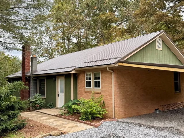 a backyard of a house with seating space