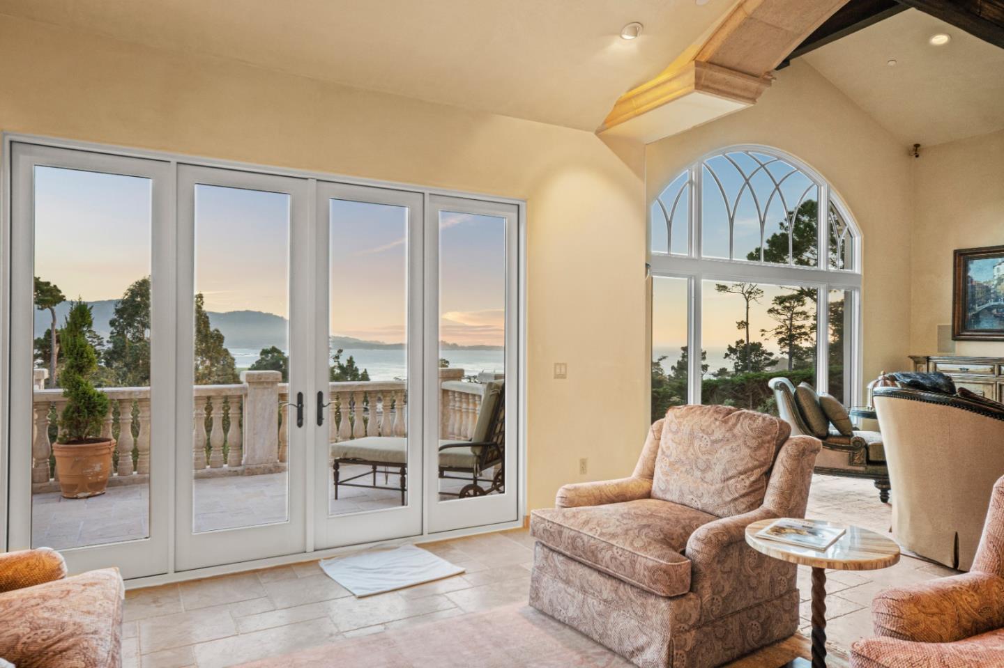1519 Riata Road Pebble Beach, CA 93953 - Photo 12 of 75 a living room with furniture a floor to ceiling window and a couch