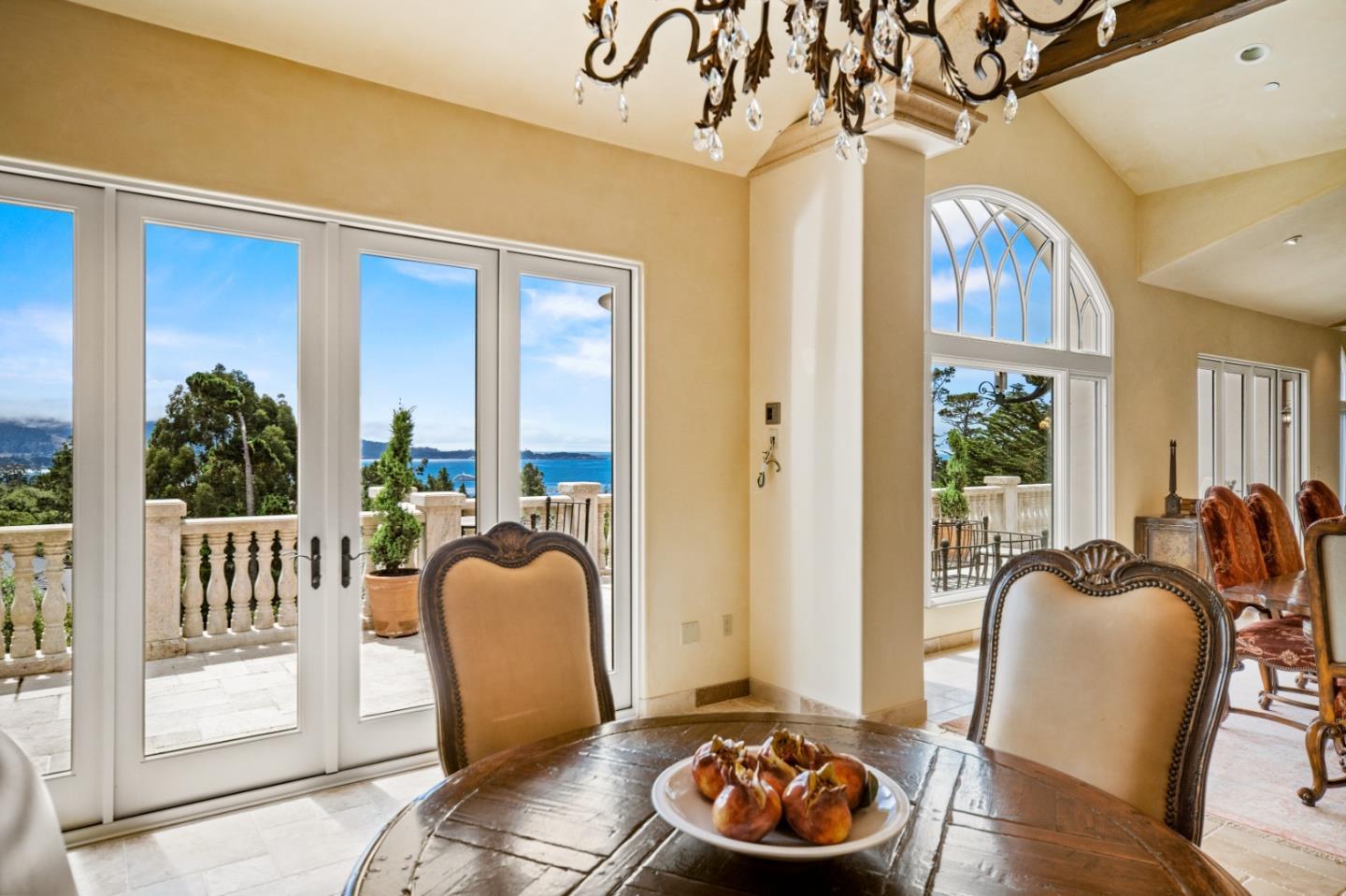 1519 Riata Road Pebble Beach, CA 93953 - Photo 16 of 75 a living room with furniture and a floor to ceiling window