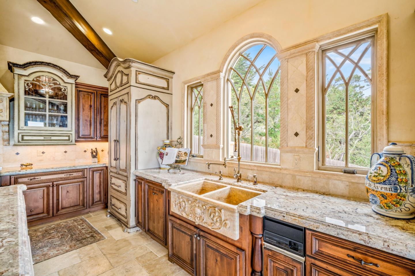 1519 Riata Road Pebble Beach, CA 93953 - Photo 18 of 75 a spacious bathroom with a granite countertop double vanity sink a mirror a bathtub and next to a window