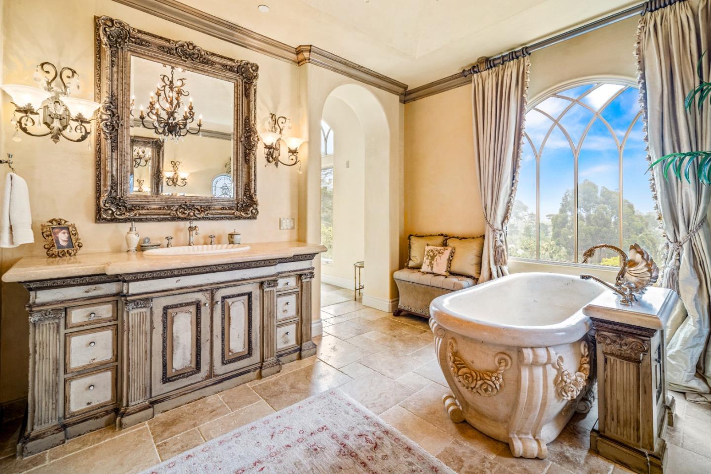 1519 Riata Road Pebble Beach, CA 93953 - Photo 29 of 75 a bathroom with a sink a toilet and a bathtub