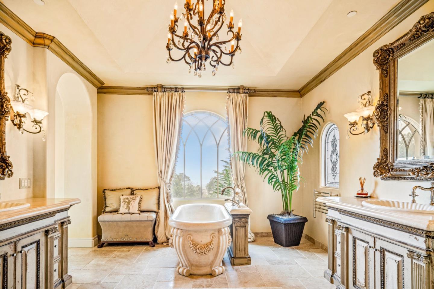 1519 Riata Road Pebble Beach, CA 93953 - Photo 31 of 75 a bathroom with a granite countertop sink and a mirror