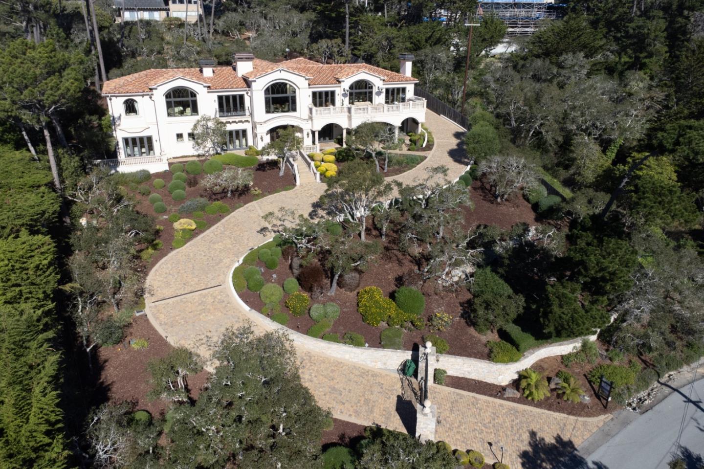 1519 Riata Road Pebble Beach, CA 93953 - Photo 4 of 75 an aerial view of a house with a yard and trees