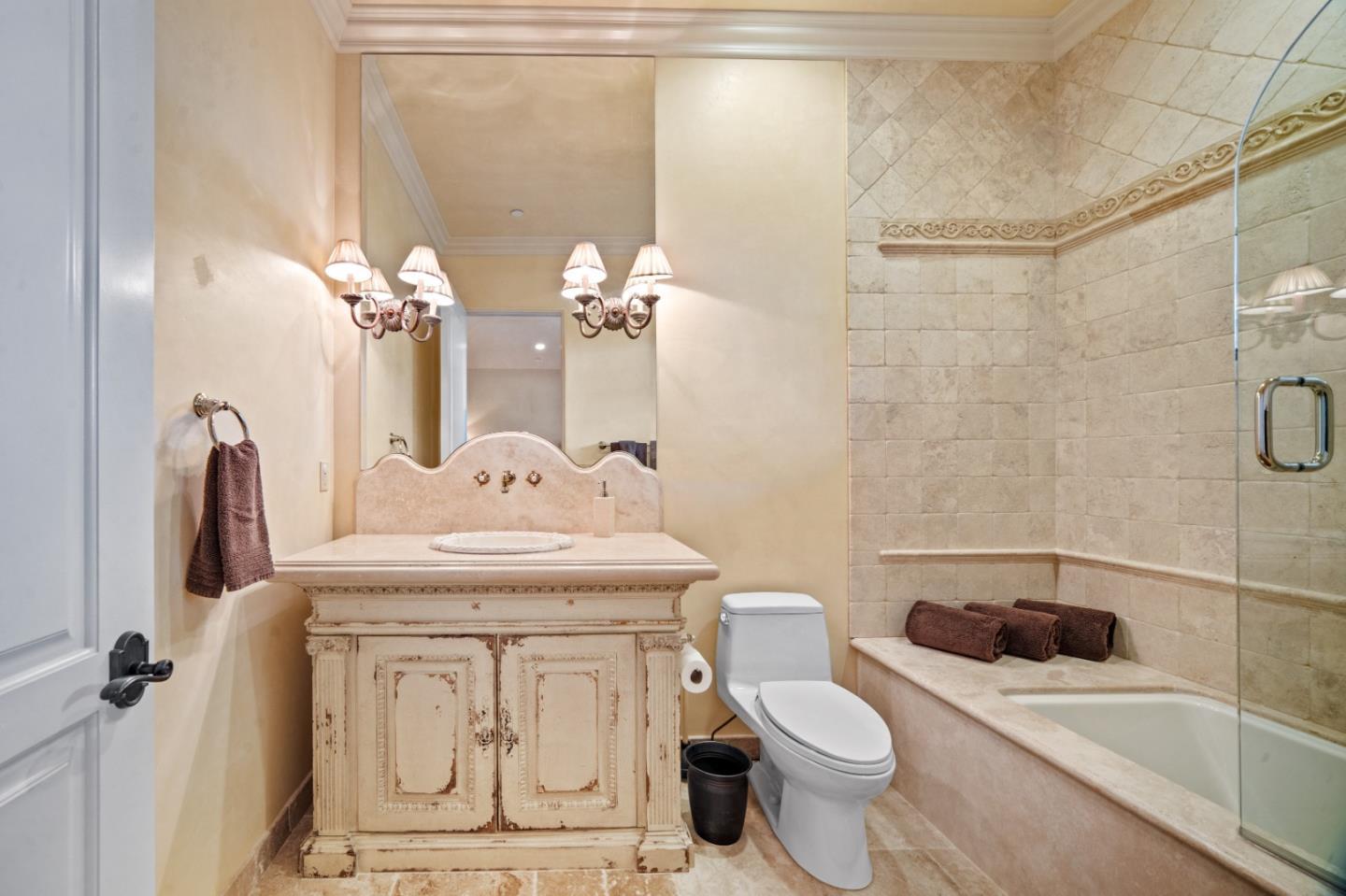 1519 Riata Road Pebble Beach, CA 93953 - Photo 55 of 75 a bathroom with a sink a toilet and shower