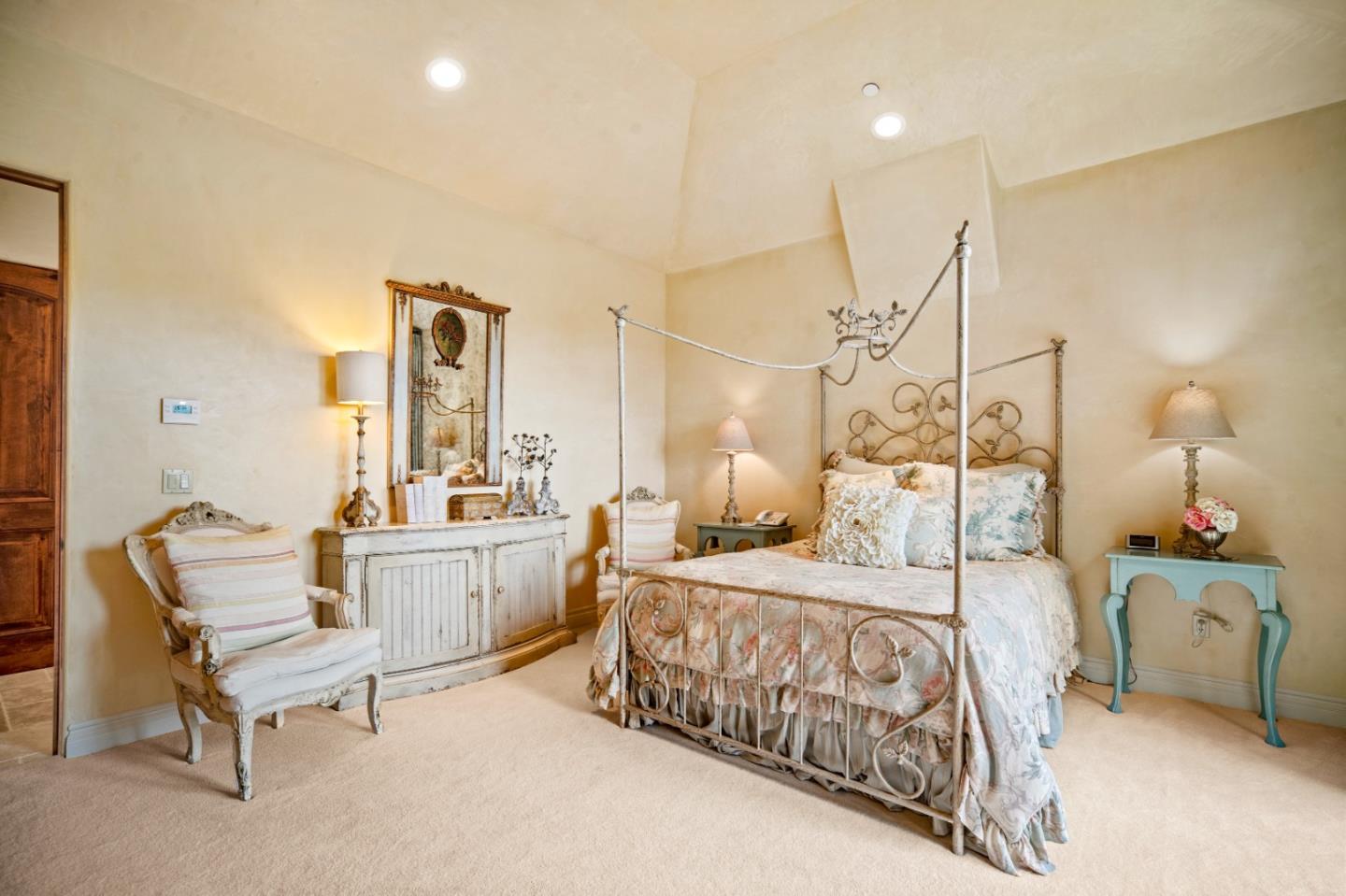 1519 Riata Road Pebble Beach, CA 93953 - Photo 59 of 75 a bedroom with a bed and a table