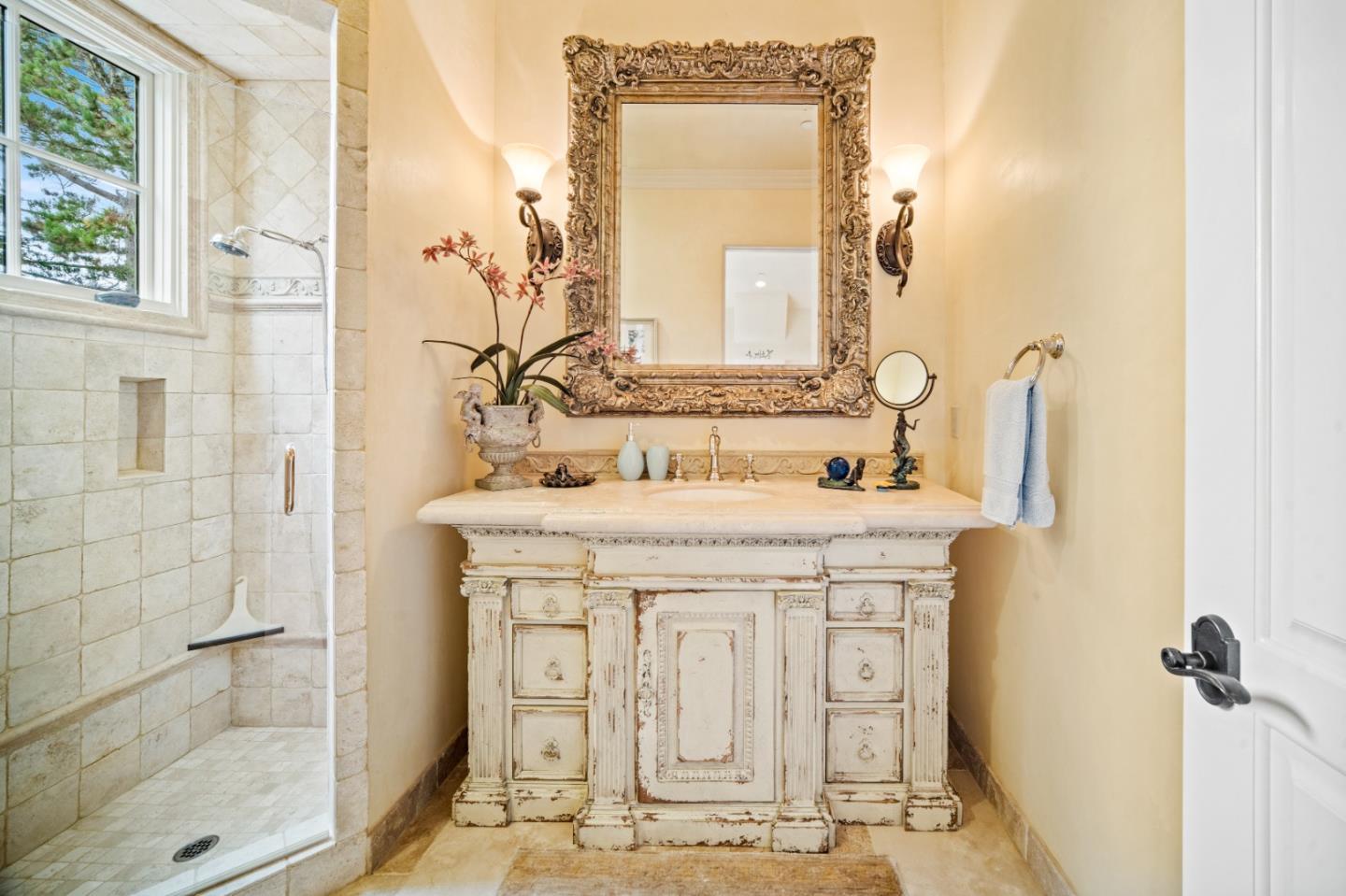 1519 Riata Road Pebble Beach, CA 93953 - Photo 61 of 75 a bathroom with a sink and a mirror