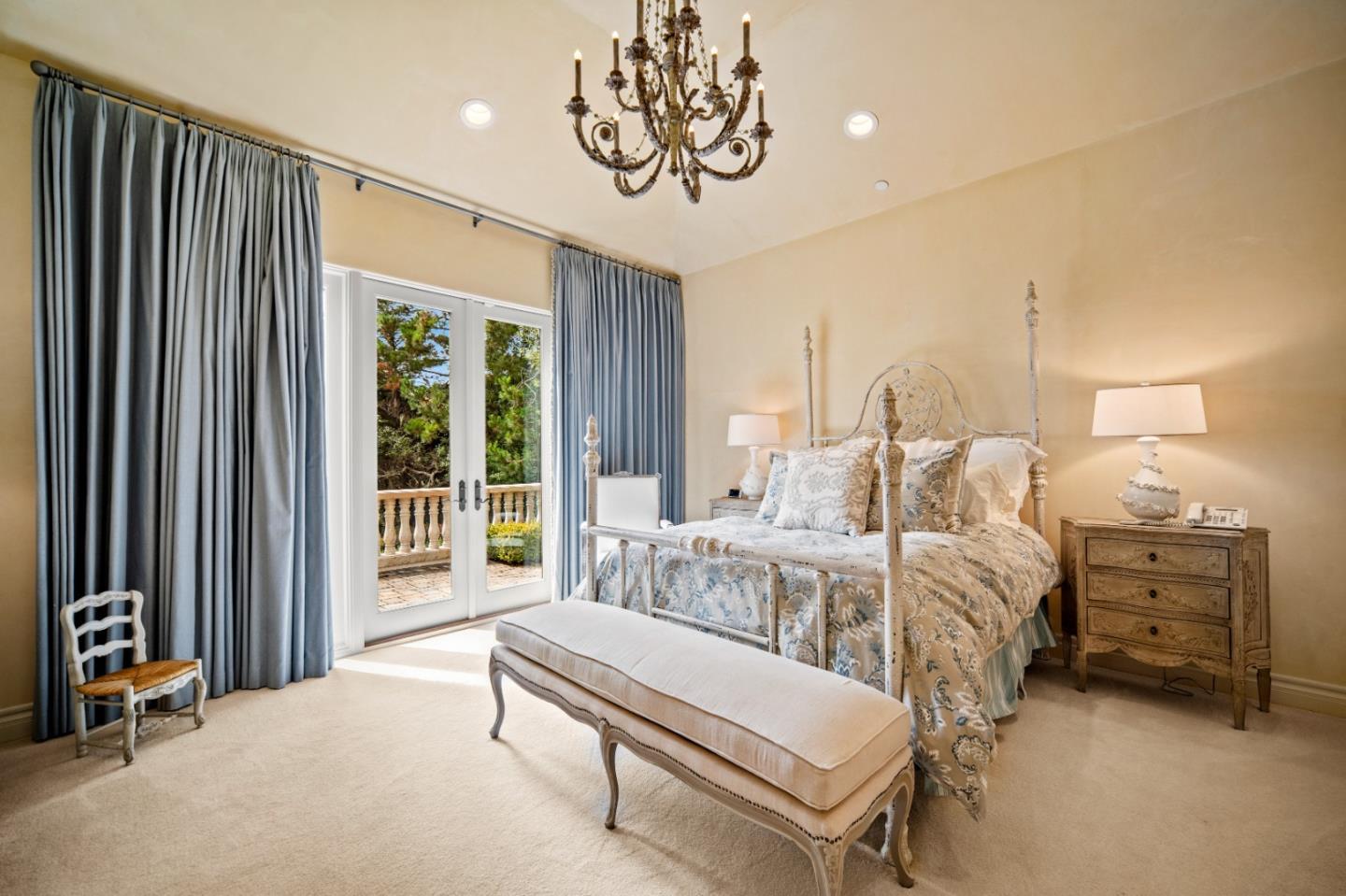 1519 Riata Road Pebble Beach, CA 93953 - Photo 64 of 75 a bedroom with furniture and a large window