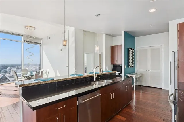 a view of a dining room with a table and chairs