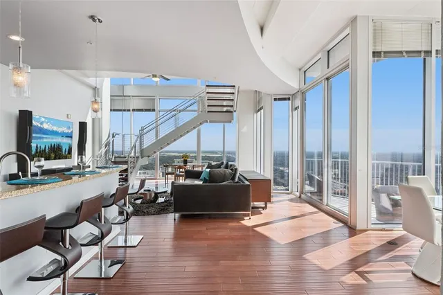 a bedroom with a large bed and a large window