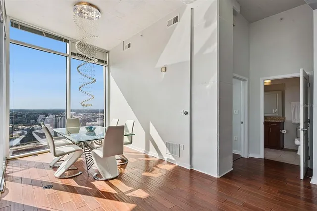 a bedroom with a bed and a ceiling fan