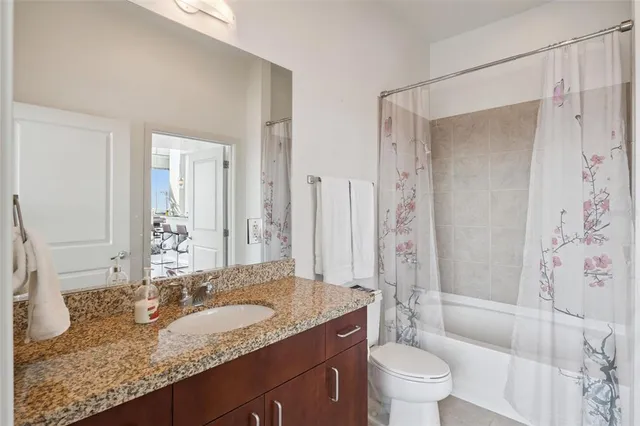 a lobby with furniture and a potted plant