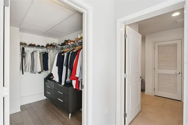 a view of a livingroom with furniture and a hallway