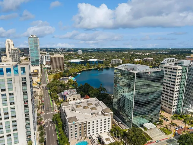 a kitchen with a sink and a wooden floor