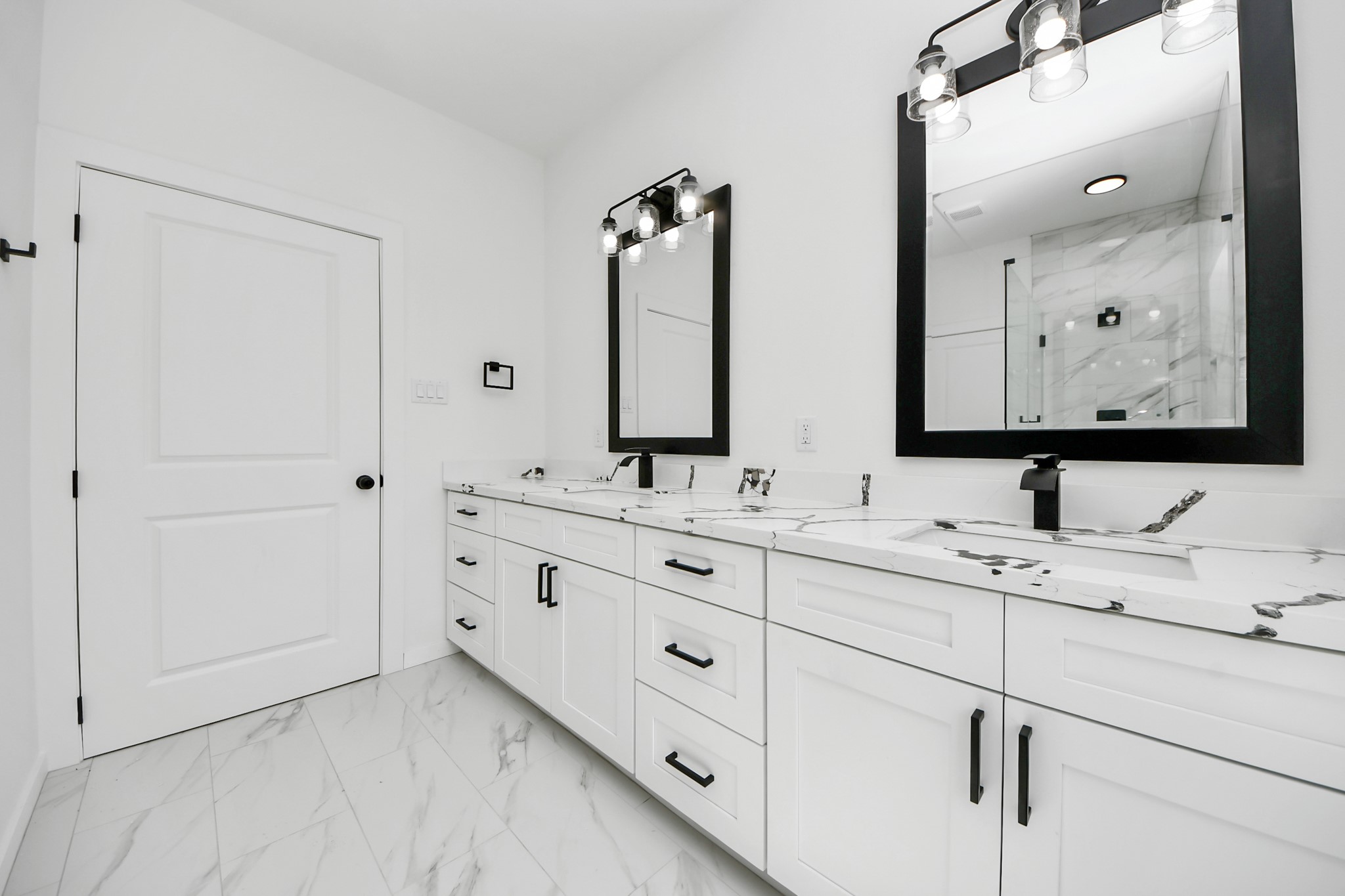 8023 Brandon Street Houston, TX 77051 - Photo 6 of 10 a bathroom with double sink and a mirror