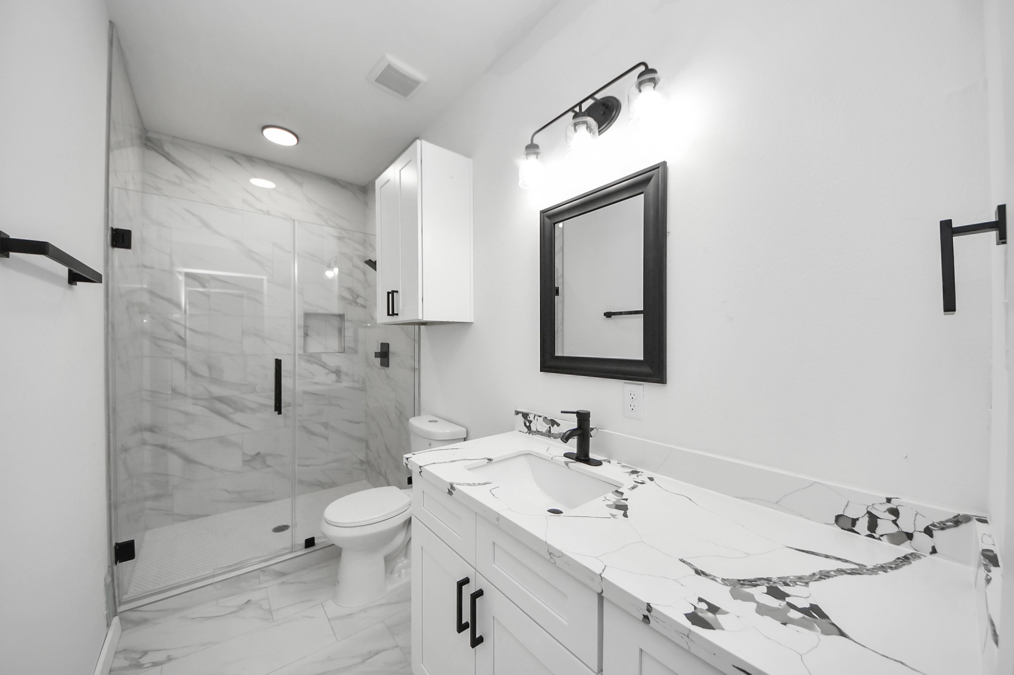 8023 Brandon Street Houston, TX 77051 - Photo 8 of 10 a bathroom with a sink toilet and shower