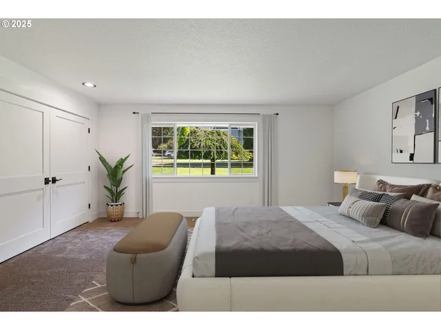 a bedroom with a bed and a couch