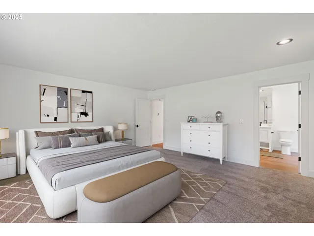 a spacious bedroom with a bed and a couch