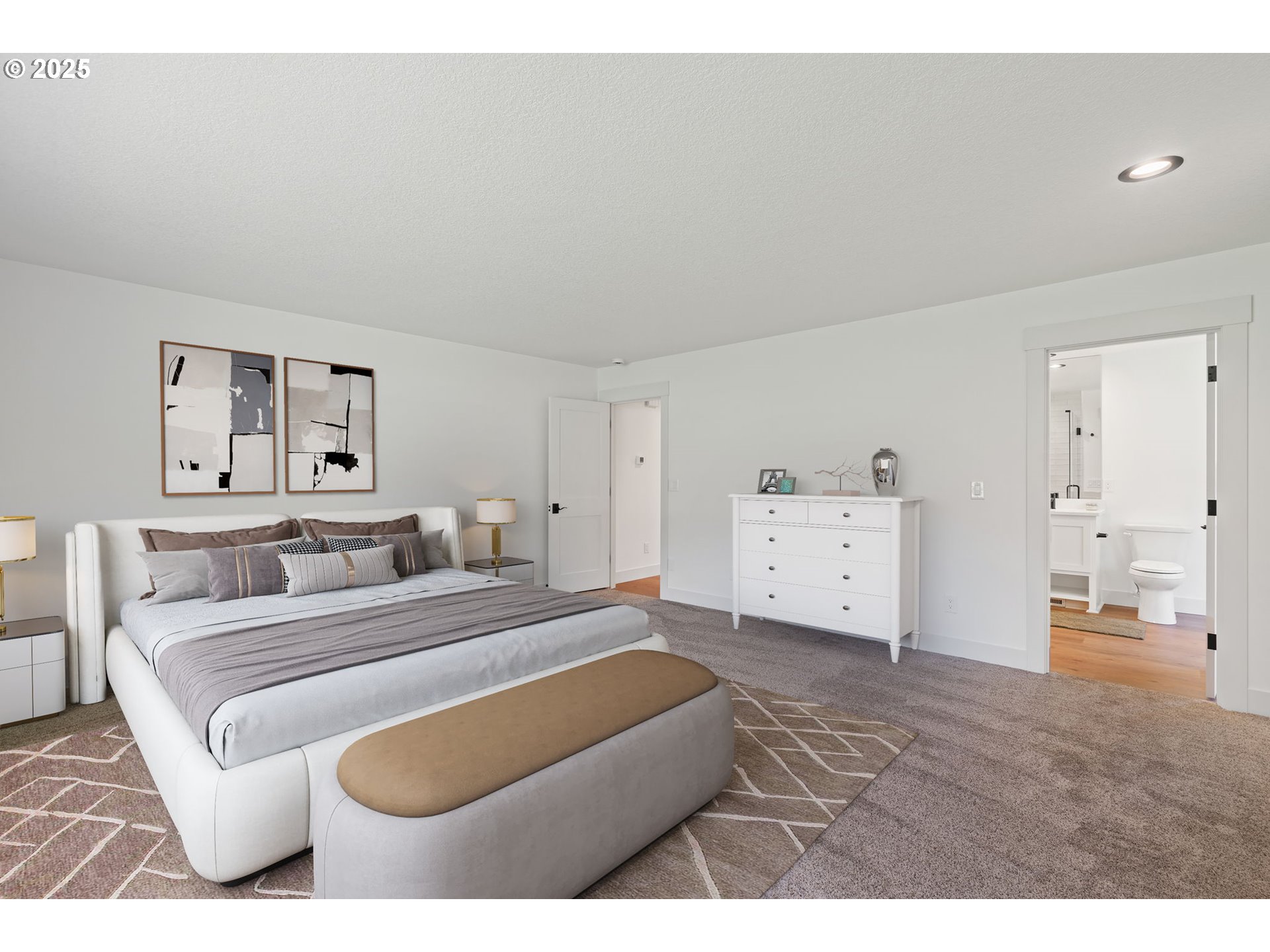 25600 Northeast 152nd Avenue Battle Ground, WA 98604 - Photo 18 of 48 a spacious bedroom with a bed and a couch