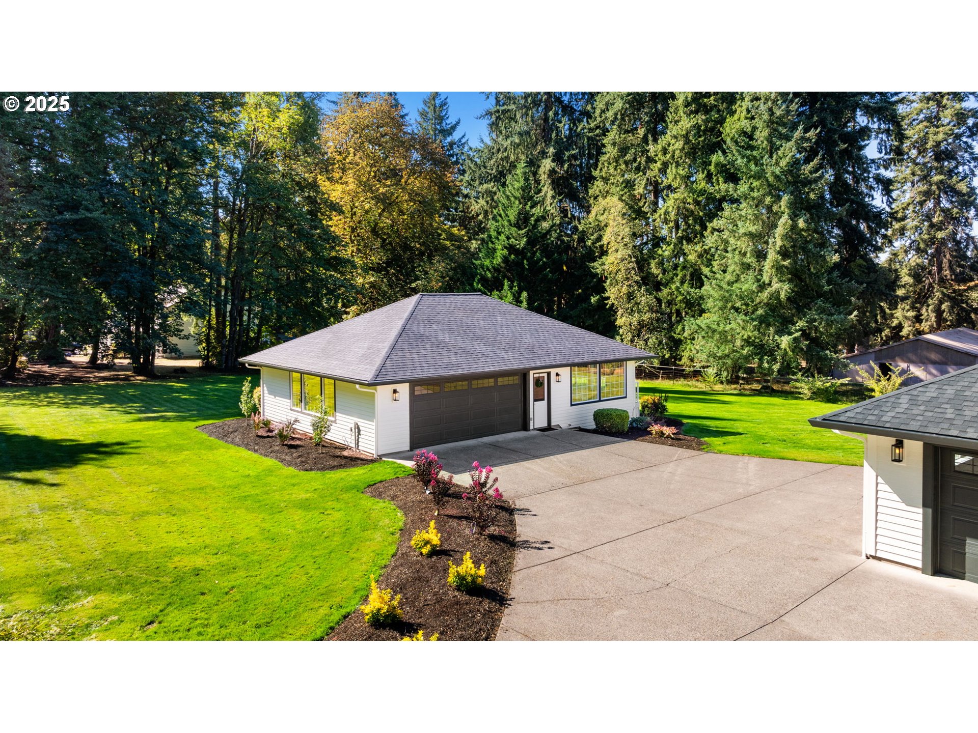 25600 Northeast 152nd Avenue Battle Ground, WA 98604 - Photo 2 of 48 a backyard of a house with yard swimming pool and outdoor seating