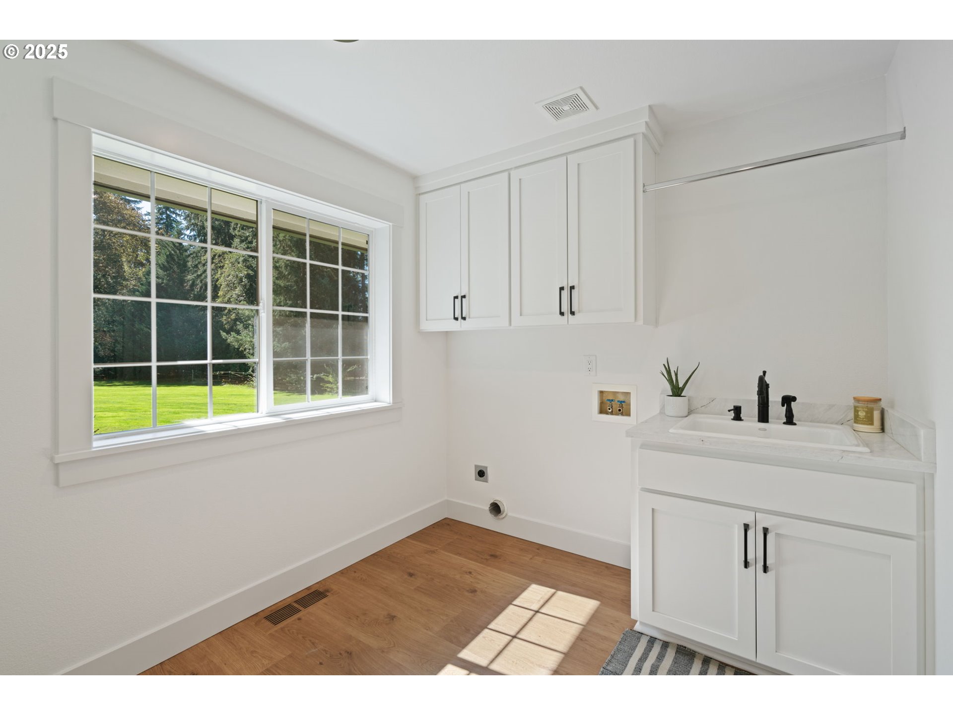 25600 Northeast 152nd Avenue Battle Ground, WA 98604 - Photo 27 of 48 a kitchen with a sink cabinets and a window