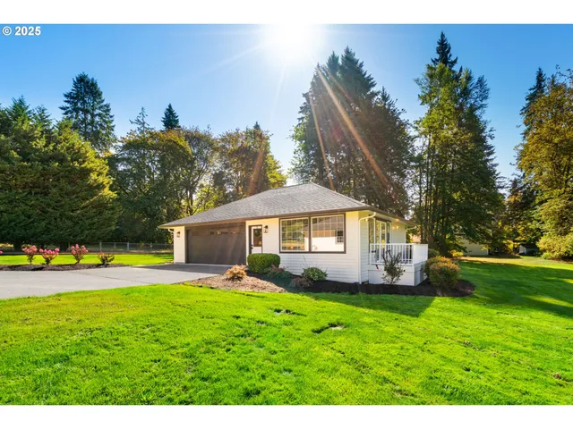 a living room with furniture and a dining table