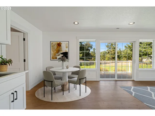 a kitchen with a table and chairs