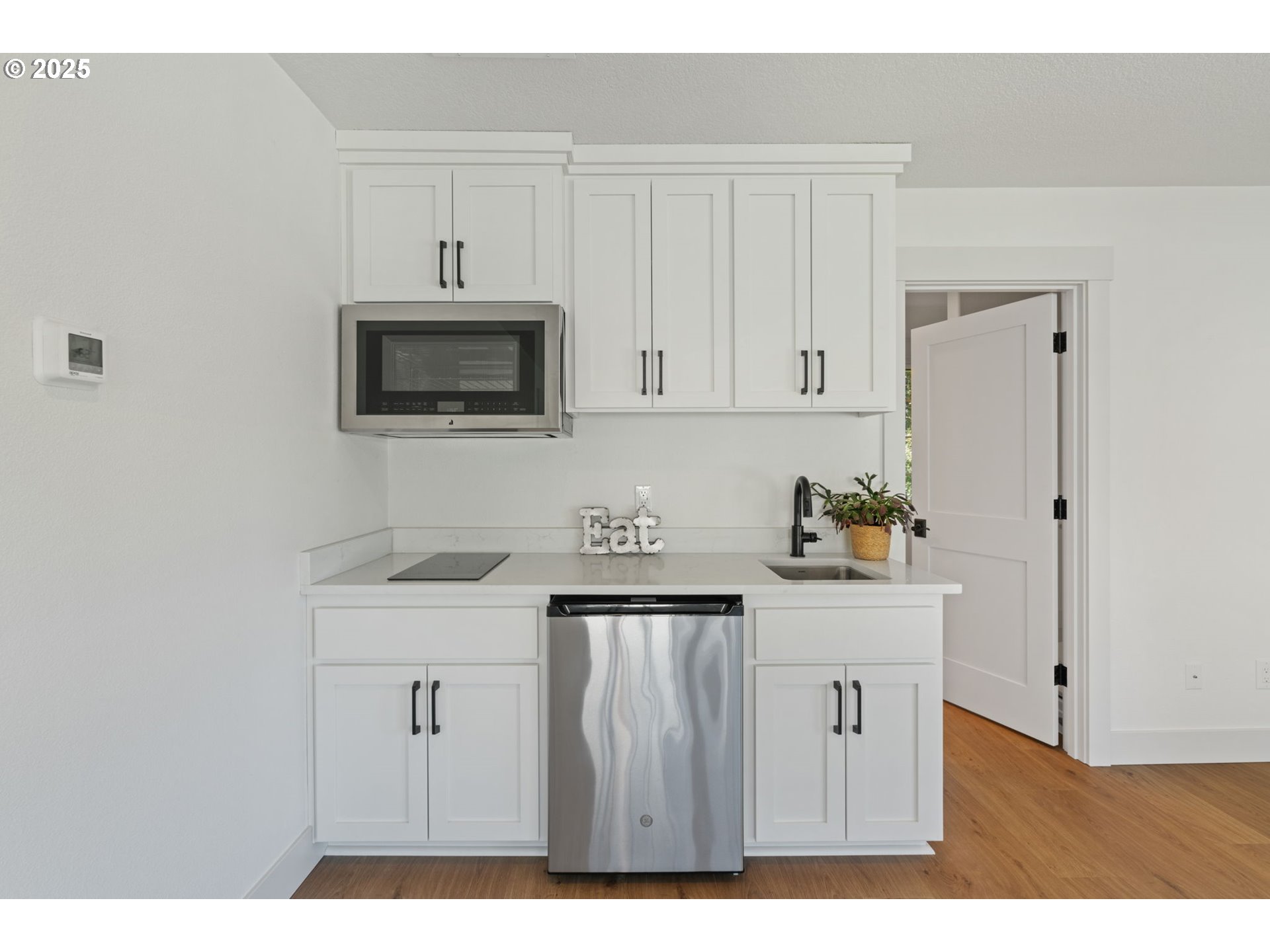 25600 Northeast 152nd Avenue Battle Ground, WA 98604 - Photo 36 of 48 a kitchen with stainless steel appliances white cabinets and a sink