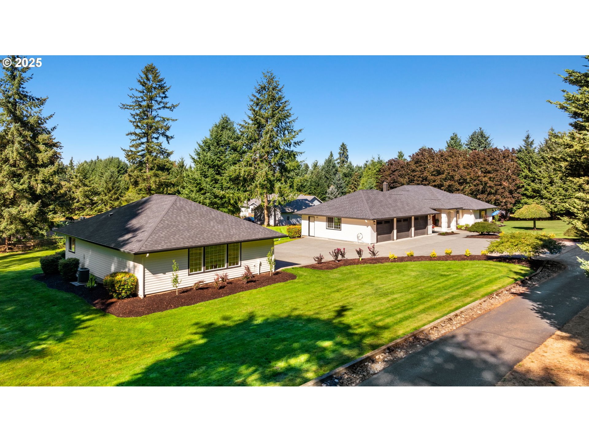 25600 Northeast 152nd Avenue Battle Ground, WA 98604 - Photo 42 of 48 a view of house with garden space and trees