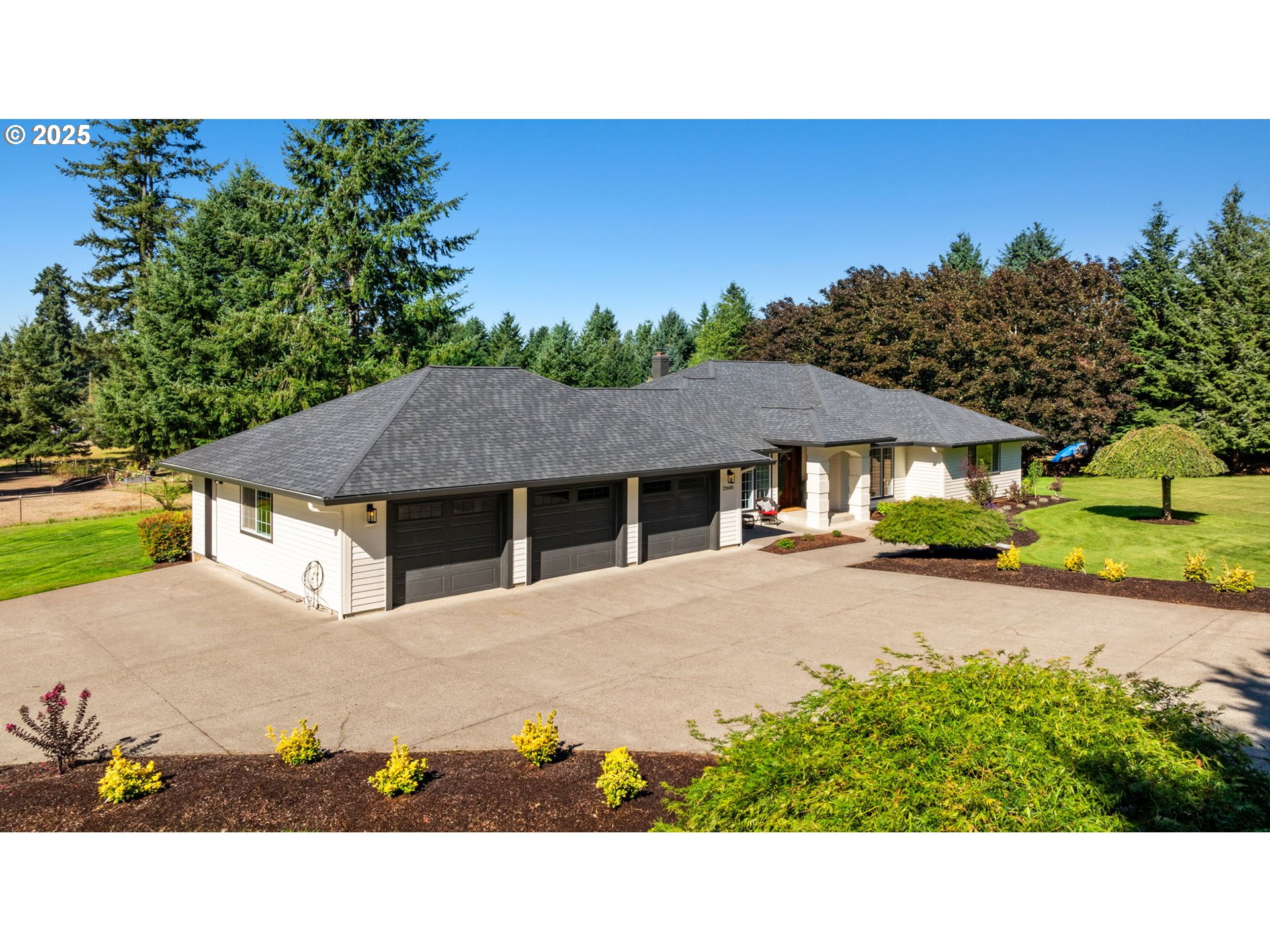 25600 Northeast 152nd Avenue Battle Ground, WA 98604 - Photo 43 of 48 a balcony with a view of the house and outdoor space