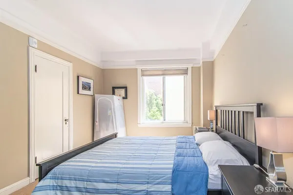 a view of a livingroom with wooden floor and furniture