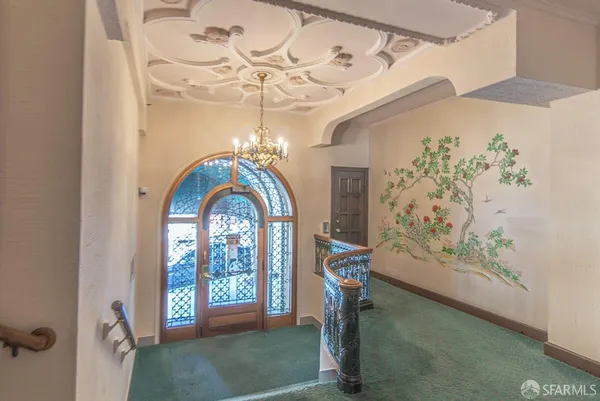 a view of a livingroom with a window and furniture