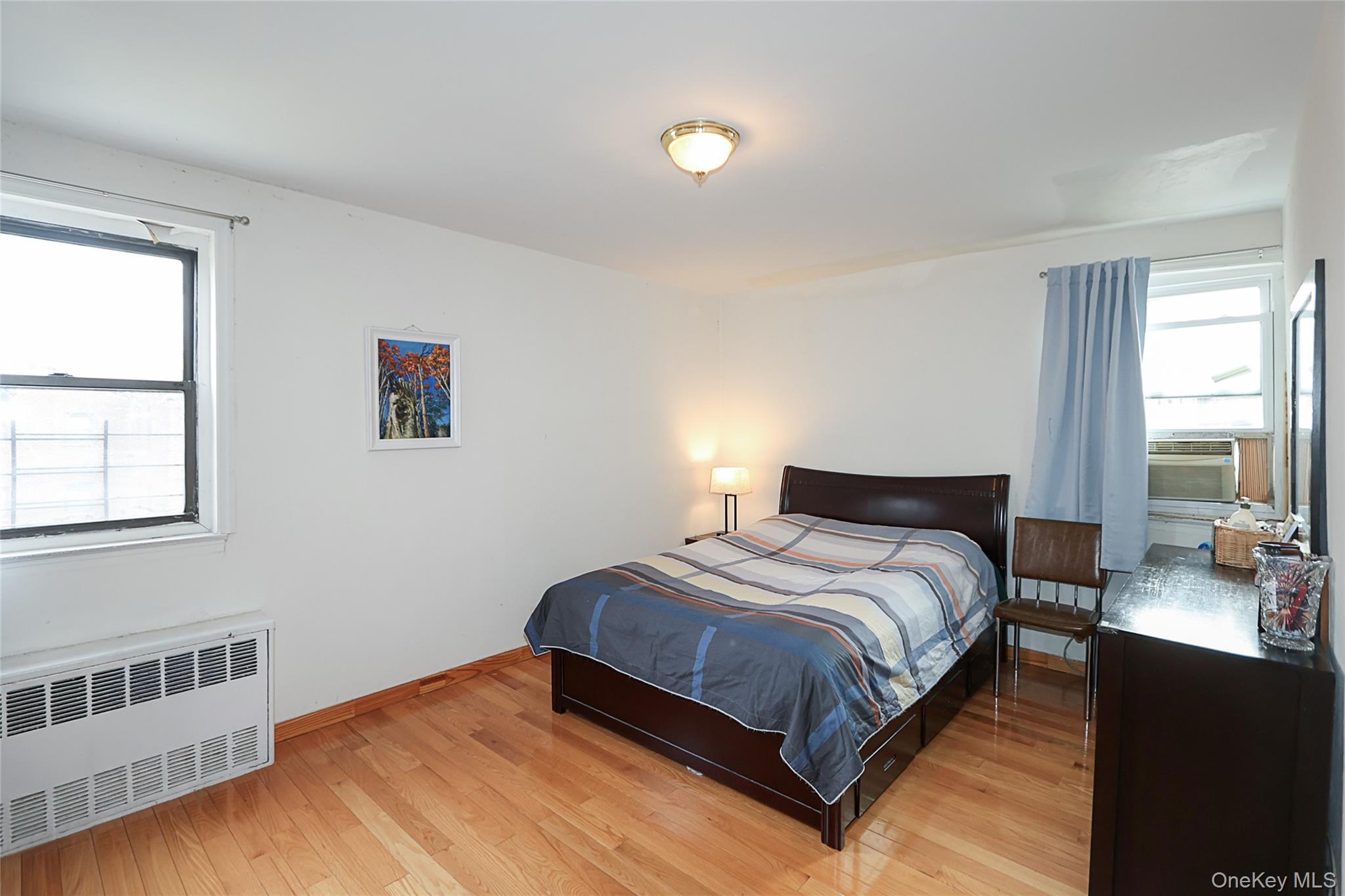 196-23 73rd Avenue, Unit 2 Queens, NY 11366 - Photo 15 of 19 a bedroom with a bed and window