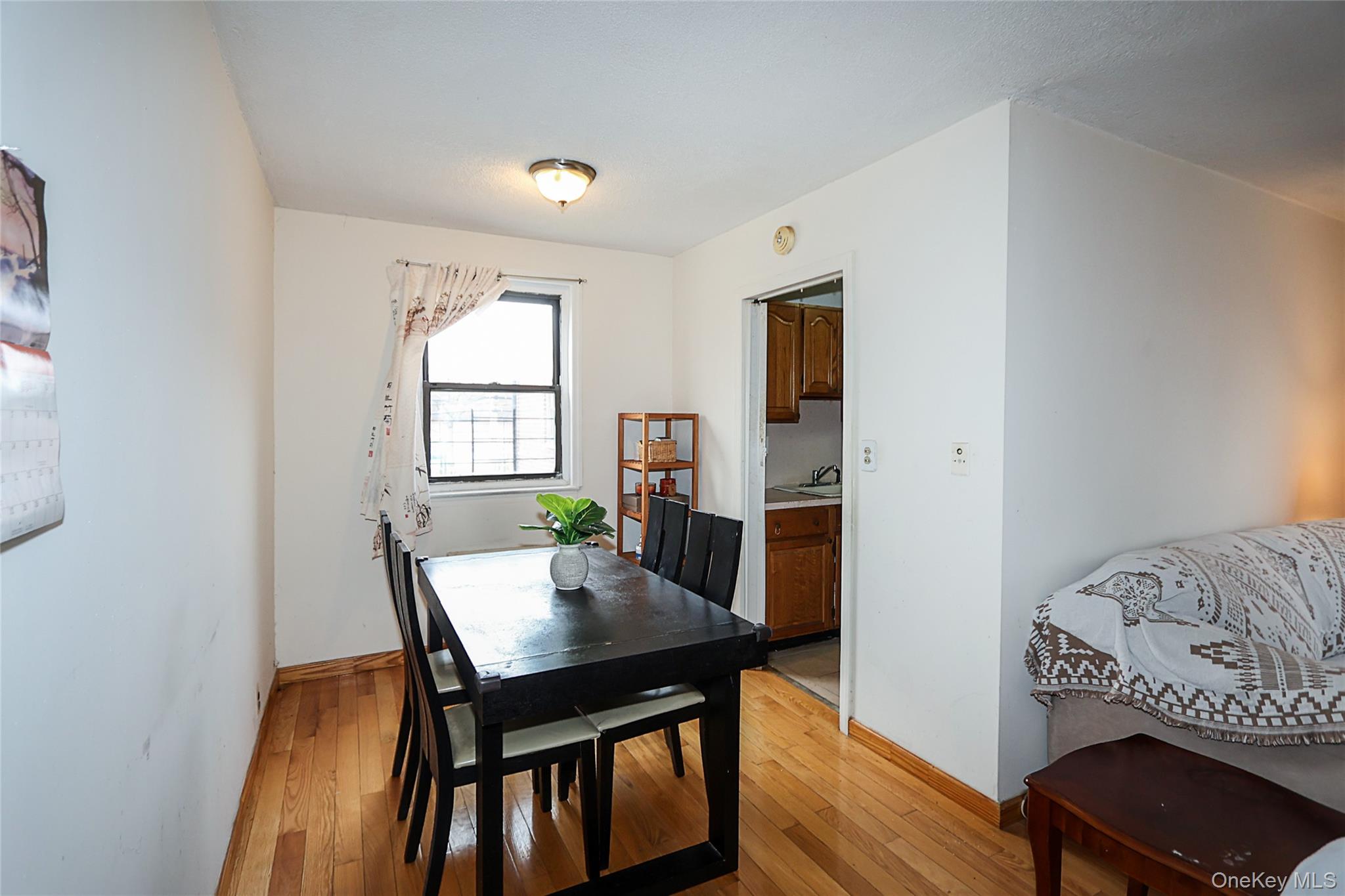 196-23 73rd Avenue, Unit 2 Queens, NY 11366 - Photo 8 of 19 a view of a dining room with furniture