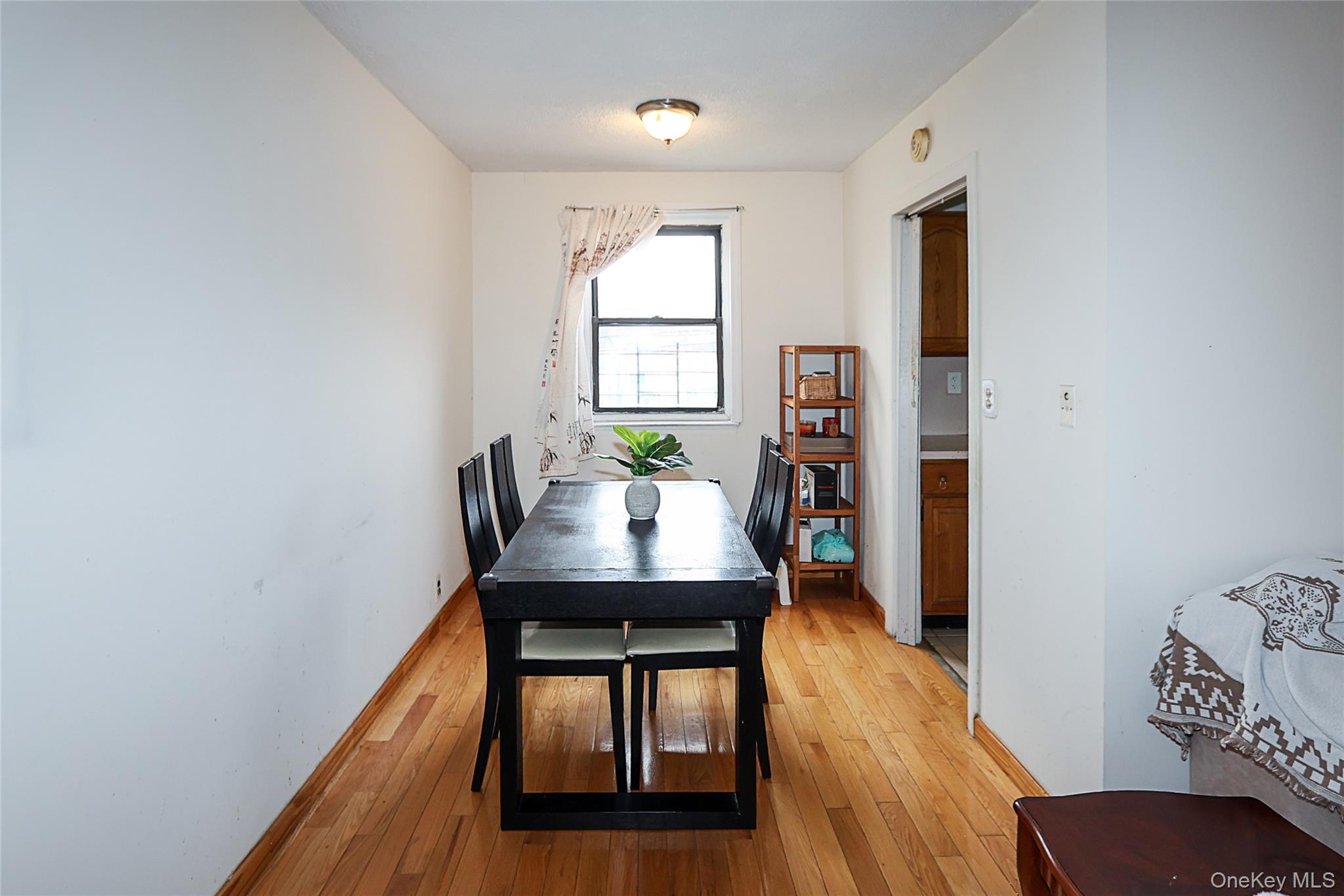 196-23 73rd Avenue, Unit 2 Queens, NY 11366 - Photo 9 of 19 a view of a dining room with furniture and wooden floor
