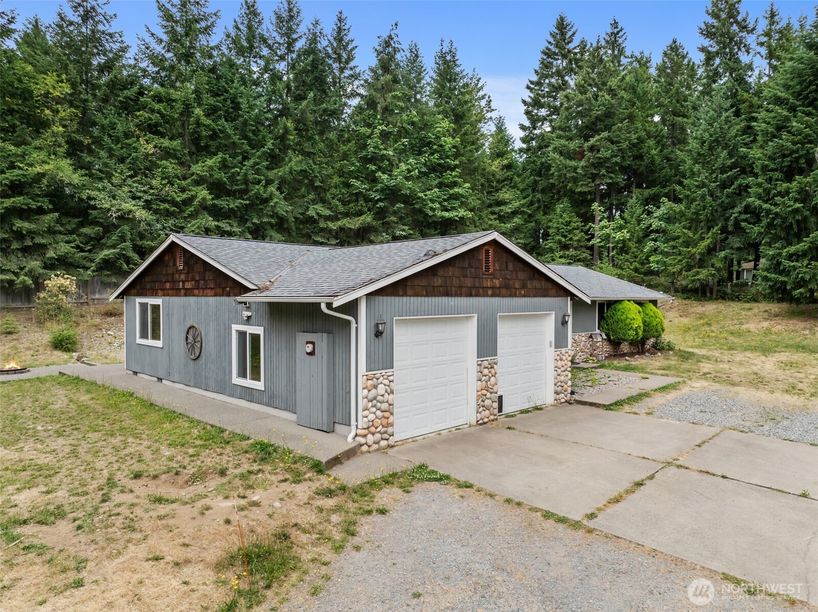 19221 Patterson Road East Orting, WA 98360 - Photo 1 of 40 a view of a house with a yard and large tree