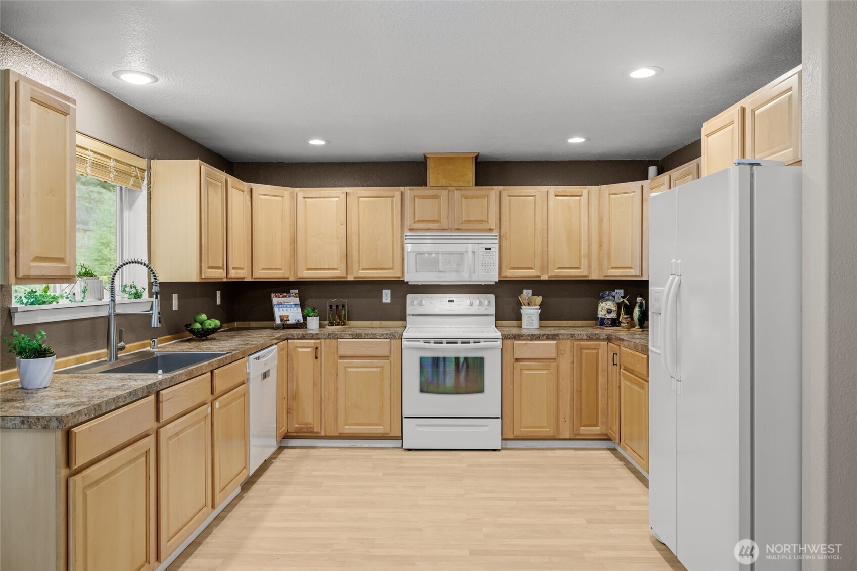 19221 Patterson Road East Orting, WA 98360 - Photo 14 of 40 a kitchen with a white cabinets and window